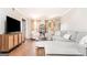 Bright living room features hardwood floors, plush seating, and ample natural light at 12 Independence Nw Pl # 12, Atlanta, GA 30318
