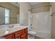 Clean bathroom with tub, shower, and wood vanity at 55 Clearbrook Ct, Covington, GA 30016