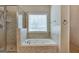 Bathroom with shower, jetted tub, and tile flooring at 55 Clearbrook Ct, Covington, GA 30016