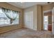 Well-lit bedroom with double doors and a window at 55 Clearbrook Ct, Covington, GA 30016