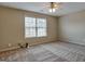 Spacious bedroom with large window and ceiling fan at 55 Clearbrook Ct, Covington, GA 30016