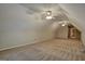 Spacious bonus room with carpet and ceiling fans at 55 Clearbrook Ct, Covington, GA 30016