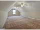 Large bonus room with two ceiling fans and window at 55 Clearbrook Ct, Covington, GA 30016