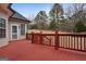 Red wooden deck with gate and yard view at 55 Clearbrook Ct, Covington, GA 30016