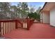 Red wooden deck with gate and yard view at 55 Clearbrook Ct, Covington, GA 30016