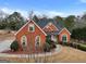 Brick house with gray roof and landscaping at 55 Clearbrook Ct, Covington, GA 30016