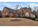 Ranch style brick home with landscaping and a large yard at 55 Clearbrook Ct, Covington, GA 30016