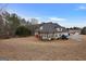 House exterior with a large backyard at 55 Clearbrook Ct, Covington, GA 30016