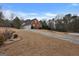 House exterior with a long driveway and landscaping at 55 Clearbrook Ct, Covington, GA 30016