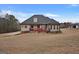 House exterior showcasing back deck and yard at 55 Clearbrook Ct, Covington, GA 30016