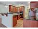 Kitchen with granite countertops and dark wood cabinets at 55 Clearbrook Ct, Covington, GA 30016