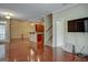 Kitchen with hardwood floors, an island, and stairs at 55 Clearbrook Ct, Covington, GA 30016
