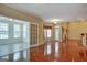 Bright living room with hardwood floors and access to sunroom at 55 Clearbrook Ct, Covington, GA 30016