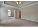 Main bedroom with carpet flooring and access to office at 55 Clearbrook Ct, Covington, GA 30016
