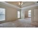 Spacious main bedroom with carpet and ceiling fan at 55 Clearbrook Ct, Covington, GA 30016