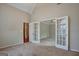 Main bedroom with carpet and views to office and hallway at 55 Clearbrook Ct, Covington, GA 30016