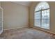 Home office with carpet and large arched window at 55 Clearbrook Ct, Covington, GA 30016