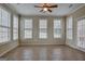 Sunroom with tile floors and multiple windows at 55 Clearbrook Ct, Covington, GA 30016