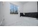 Bright bathroom with a modern tub, stylish tile floors, and large window at 90 Ayers Rd, Bowdon, GA 30108