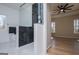 Modern bathroom featuring black tiling, white fixtures and a large shower at 90 Ayers Rd, Bowdon, GA 30108