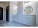 Bright bathroom boasts dual vanities with modern fixtures, stylish mirrors, and ample storage space at 90 Ayers Rd, Bowdon, GA 30108