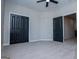 Bedroom with a double door closet, carpeting, and a view to the hall at 90 Ayers Rd, Bowdon, GA 30108