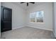 Neutral bedroom with window looking out to wooded area at 90 Ayers Rd, Bowdon, GA 30108