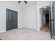 Neutral bedroom featuring a closet and doorway at 90 Ayers Rd, Bowdon, GA 30108