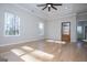 Well-lit bedroom featuring large windows and hardwood floors at 90 Ayers Rd, Bowdon, GA 30108