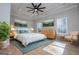 Stylishly staged bedroom with a cozy rug, accent chair, and decorative artwork at 90 Ayers Rd, Bowdon, GA 30108