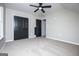 Bedroom showcasing carpet, ceiling fan, light-colored walls, and a large closet at 90 Ayers Rd, Bowdon, GA 30108