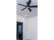 Bedroom with a ceiling fan, a black interior door, and neutral colored walls at 90 Ayers Rd, Bowdon, GA 30108