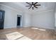 Spacious bedroom boasting tray ceilings and two entryway doors at 90 Ayers Rd, Bowdon, GA 30108
