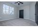 Bedroom with a large window and a door leading to a double door closet at 90 Ayers Rd, Bowdon, GA 30108