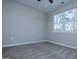 Bedroom with a window for natural light, neutral colored walls, and modern carpeting at 90 Ayers Rd, Bowdon, GA 30108