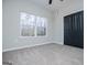 Neutral bedroom featuring a closet and a window with a view at 90 Ayers Rd, Bowdon, GA 30108