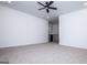 Spacious bonus room featuring neutral carpeting, a ceiling fan, and an open layout to the upper hallway at 90 Ayers Rd, Bowdon, GA 30108