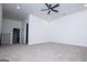 Bright bonus room with neutral carpeting, a ceiling fan, and an open doorway to the hallway at 90 Ayers Rd, Bowdon, GA 30108