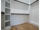 Walk-in closet with custom shelving and ample hanging space, offering an organized storage solution at 90 Ayers Rd, Bowdon, GA 30108