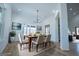 Staged dining room featuring a table with seating, artwork, and an open layout at 90 Ayers Rd, Bowdon, GA 30108
