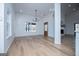 Dining room with ample lighting and hardwood floors adjacent to the entryway at 90 Ayers Rd, Bowdon, GA 30108
