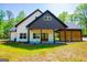 Charming house with a cozy porch and elegant architectural details at 90 Ayers Rd, Bowdon, GA 30108