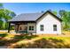 Exterior side view of a charming house with well-manicured lawn at 90 Ayers Rd, Bowdon, GA 30108