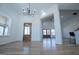 Bright foyer with wood floors, and view to the living areas with multiple windows for ample light at 90 Ayers Rd, Bowdon, GA 30108