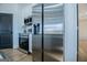 Modern stainless steel refrigerator complements the contemporary kitchen design at 90 Ayers Rd, Bowdon, GA 30108