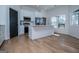 Bright kitchen with an island, stainless appliances, and a modern design at 90 Ayers Rd, Bowdon, GA 30108