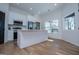 Modern kitchen boasts stainless appliances, a center island, and natural light at 90 Ayers Rd, Bowdon, GA 30108