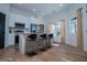 Well-lit kitchen with island seating, stainless appliances, and a modern design at 90 Ayers Rd, Bowdon, GA 30108