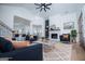 Staged living room featuring hardwood floors, a modern fireplace, and comfortable seating at 90 Ayers Rd, Bowdon, GA 30108