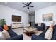 Comfortable living room with stylish blue sofas, decorative artwork, and a cozy area rug at 90 Ayers Rd, Bowdon, GA 30108